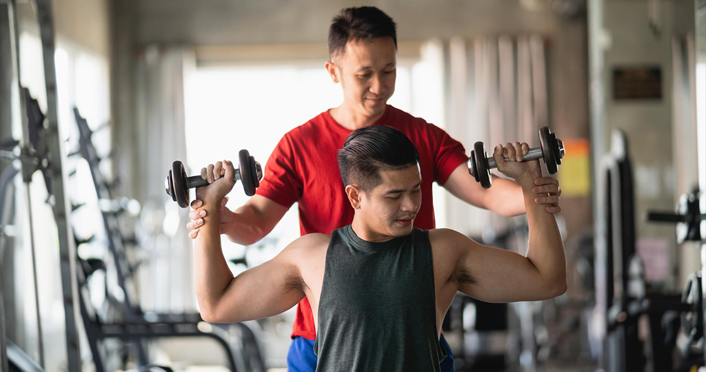 Dumbbell workouts with personal trainer