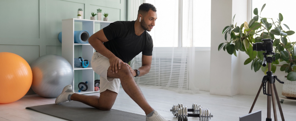 Online personal training session with a trainer guiding a client remotely.